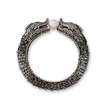 A CONTEMPORARY 'KADA' BANGLE -    - Auction of Fine Jewels