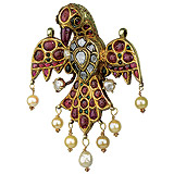 A HANDSOME GOLD AND GEM-SET BIRD PENDANT -    - Auction of Fine Jewels