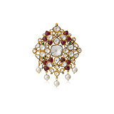 A `POLKI` DIAMOND AND RUBY PENDANT -    - Auction of Fine Jewels and Watches
