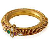 A GOLD AND GEM-SET KADA -    - Auction of Fine Jewels & Watches