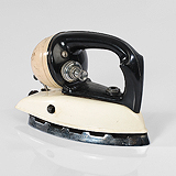 AN ART DECO TRAVEL IRON -    - Travel and Leisure Auction