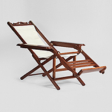 A PERIOD CAMPAIGN LOUNGE CHAIR -    - Travel and Leisure Auction
