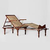 AN ELEGANT CAMPAIGN DAY BED -    - Travel and Leisure Auction