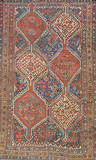 A PERSIAN TRIBAL SHIRAZ CARPET -    - Travel and Leisure Auction