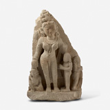 A SANDSTONE SCULPTURE OF A DEVI WITH DEVOTEE ON RIGHT AND CHILD ON LEFT -    - Live Auction: South Asian Treasures