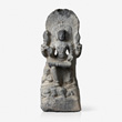 GREY GRANITE FIGURE OF SHIVA AS DAKSHINAMURTHY - Live Auction: South Asian Treasures