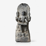 GREY GRANITE FIGURE OF SHIVA AS DAKSHINAMURTHY -    - Live Auction: South Asian Treasures