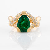 -AN EMERALD AND DIAMOND RING