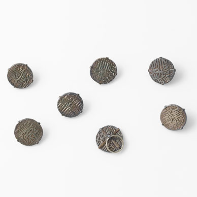 A SET OF SIX SILVER BUTTONS