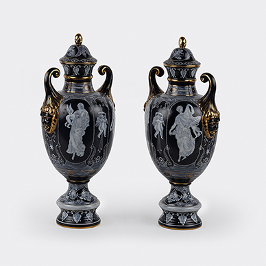 PAIR OF PORCELAIN 'PATE-SUR-PATE' URNS WITH COVERS BY MEISSEN